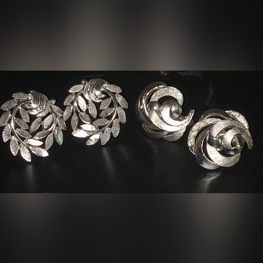 Two Vintage Crown Trifari Silverstone clip leaf wreath pattern earrings.